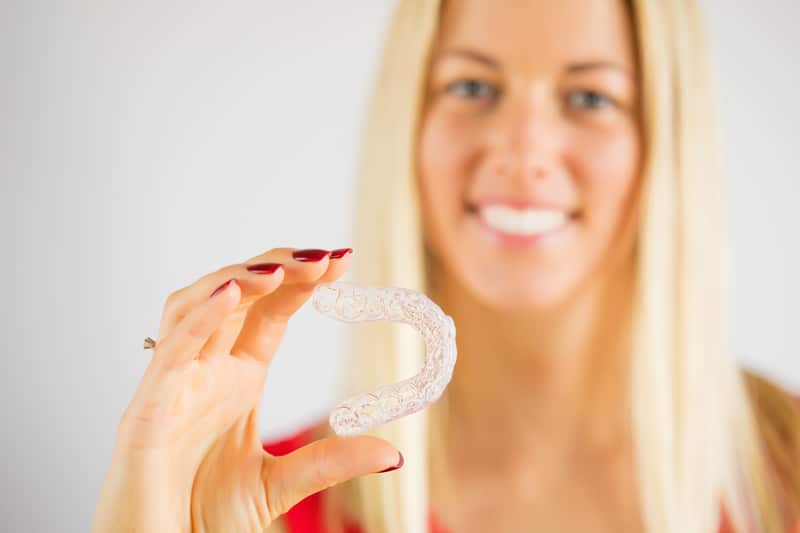 Orthodontic Associates - WHY DOES INVISALIGN TREATMENT USE ATTACHMENTS?   Attachments are tooth-colored ridges that we place on specific teeth to  help teeth move more effectively. They put force in the right